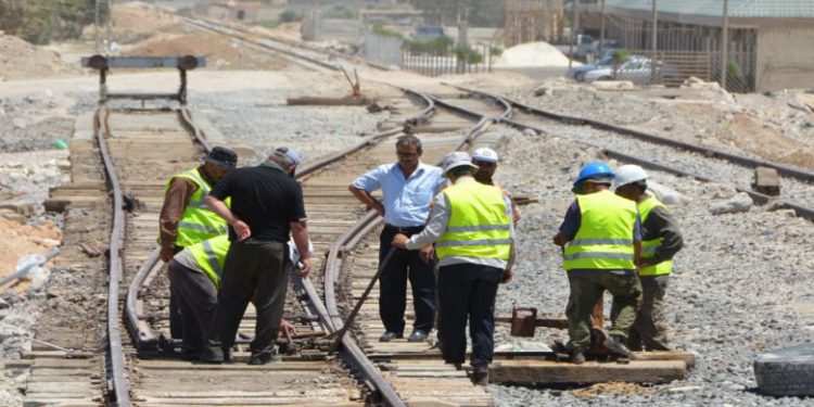 Syrian railroad workers and technicians work on the restoration of the railway in the Syrian capital Damascus on August 9, 2018. - Locomotives had chugged across Syria for over a century, carrying passengers, construction materials, oil and gas over hundreds of kilometres (miles). But train traffic came shuddering to a halt in 2012, a year into the civil war.Of the 2,450 kilometres (1,500 miles) of train tracks that cross Syria, some 1,800 kilometres will be repaired, according to the transport ministry. (Photo by Maher AL MOUNES / AFP)        (Photo credit should read MAHER AL MOUNES/AFP/Getty Images)
