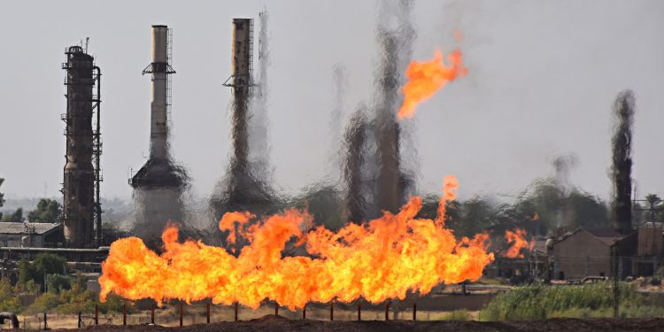Fires flare off the gas from in Kirkuk, Iraq, Wednesday, Oct. 18, 2017. Kurdish forces pulled out of disputed areas across northern and eastern Iraq a day after handing Kirkuk to federal forces amid a tense standoff following last month's vote for independence. (AP Photo/Emad Matti)