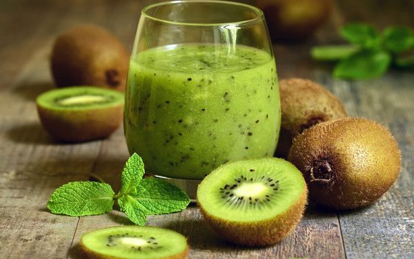 Fresh homemade kiwi juice in a glass.